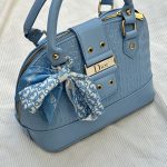 کیف نیم‌گرد دخترانه آبی با لوگوی Dior و اسکارف گل‌دار